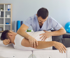 chiropractor performing care on patient recovering from motorcycle accident